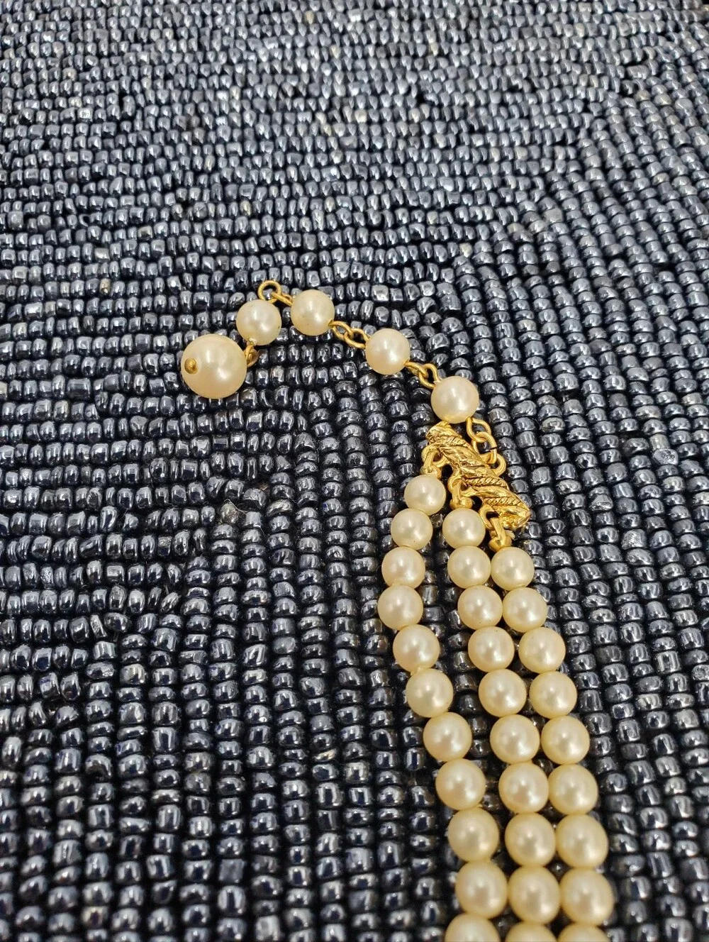 Vintage-style 3-strand pearl choker necklace with a prominent cameo centerpiece